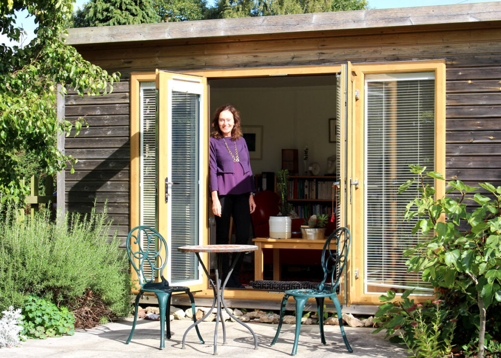 Kate standing outside her therapy studio